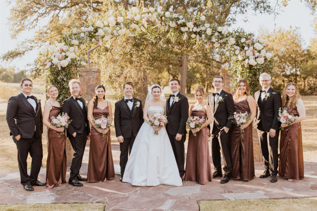Bridal party style under floral arch