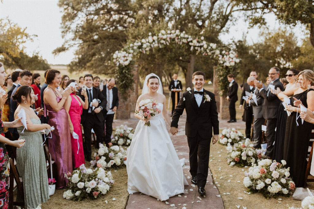 Grand ceremony exit reflecting joyful