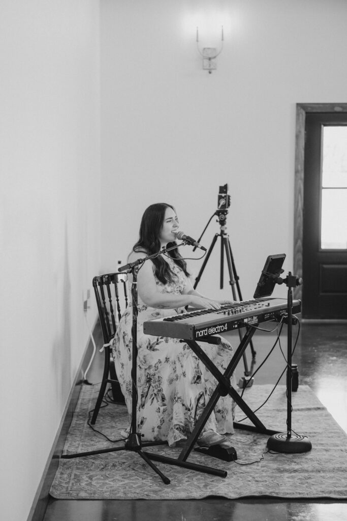 Black and white photo of live wedding music setup, showcasing 2026 wedding trends in intimate performances