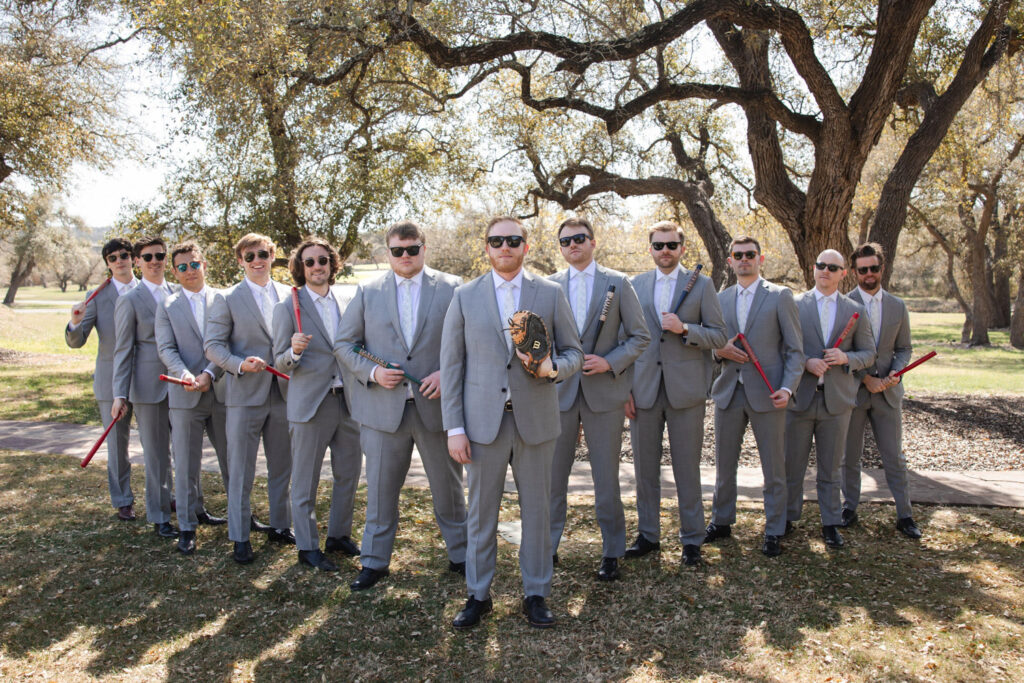 Baseball-themed groomsmen photo showing 2026 wedding trends in personality