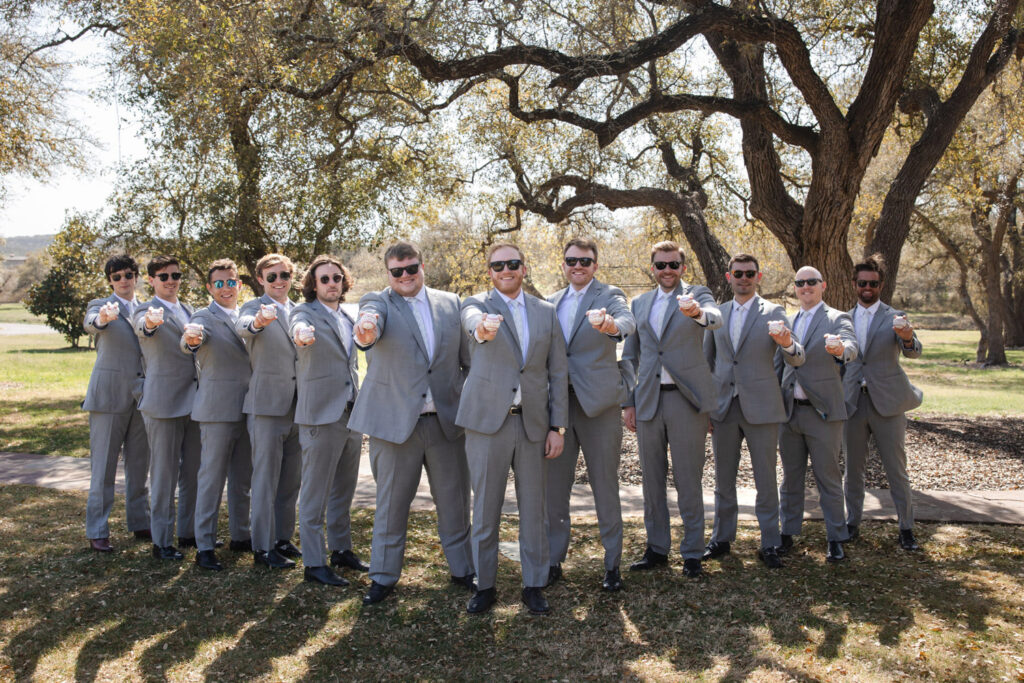 Groomsmen with signed baseballs capturing fun 2026 wedding trends