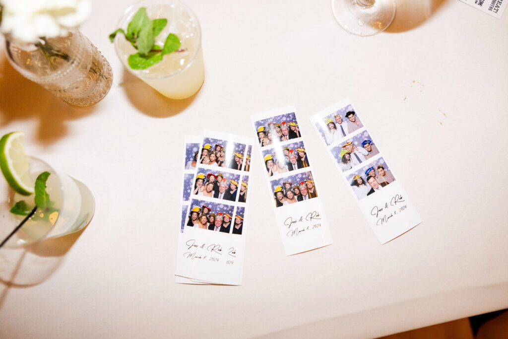 Photo booth strips on table for AI wedding planner inspiration