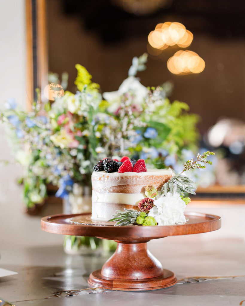 Small wedding cake with berries styled by AI wedding planner