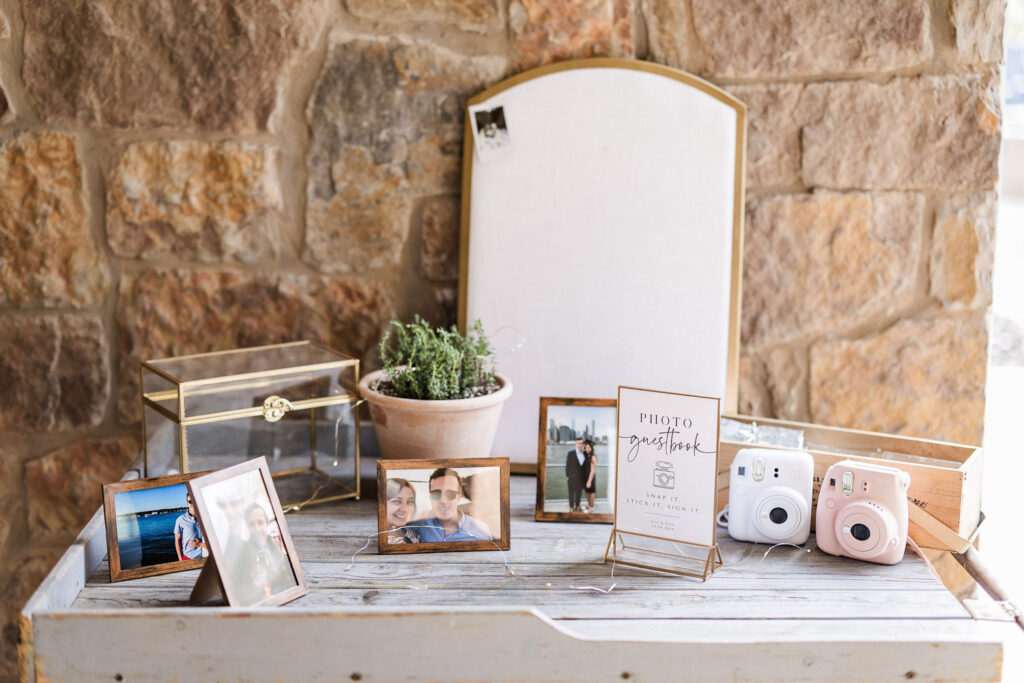 Photo guestbook table with cameras used in AI wedding planner setup