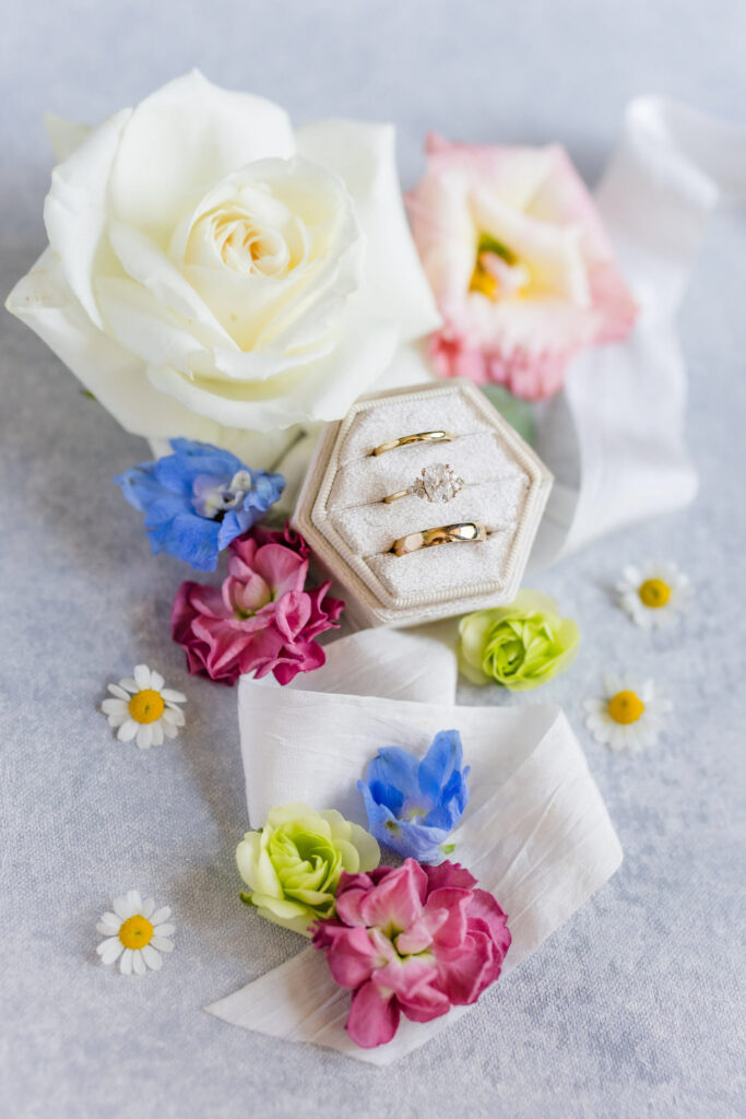 Wedding rings with flowers styled for AI wedding planner