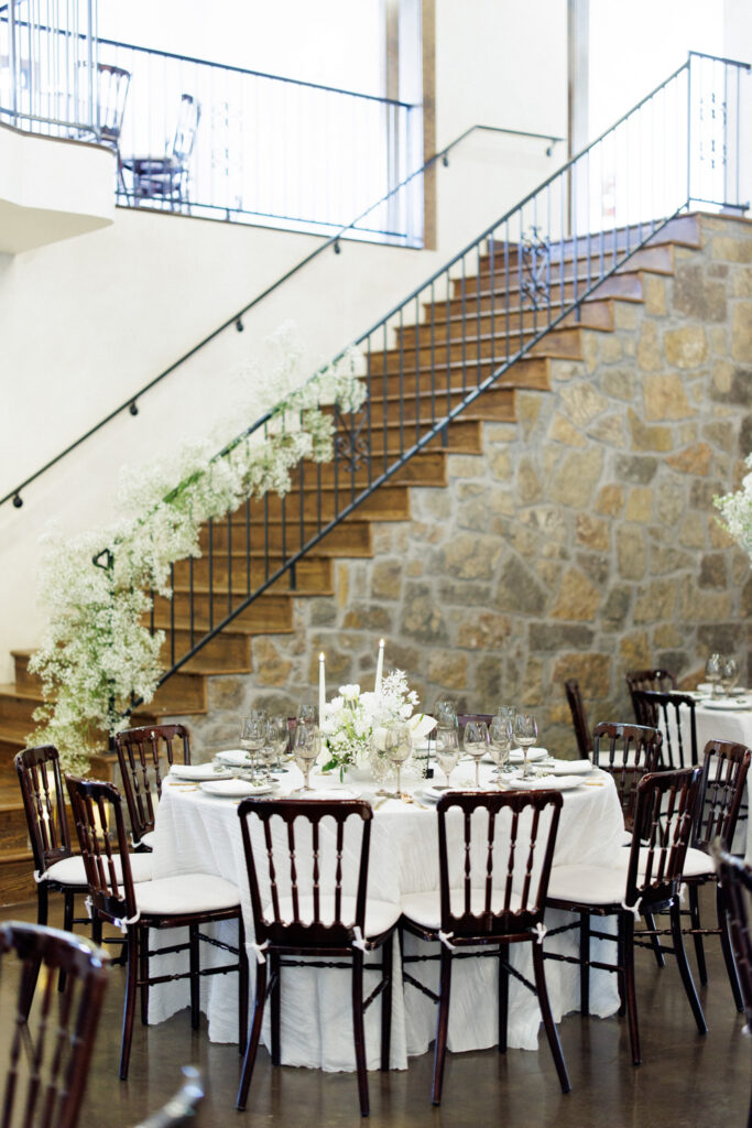 wedding reception layout with brown chairs at Ma Maison wedding venue