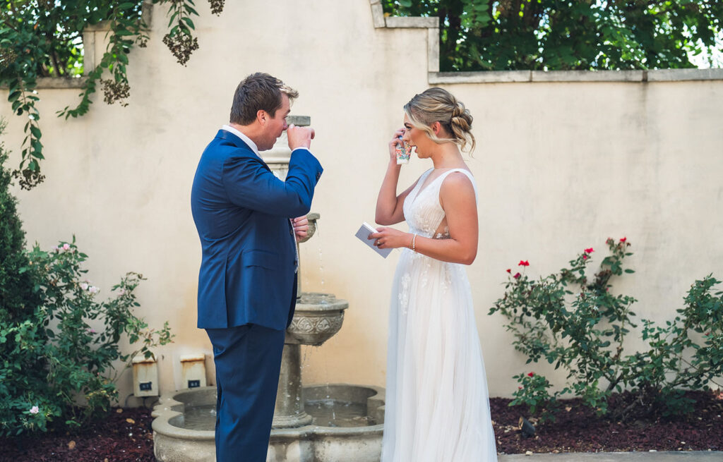 Couple exchanging personalized wedding vows at Ma Maison, an Austin Wedding venue