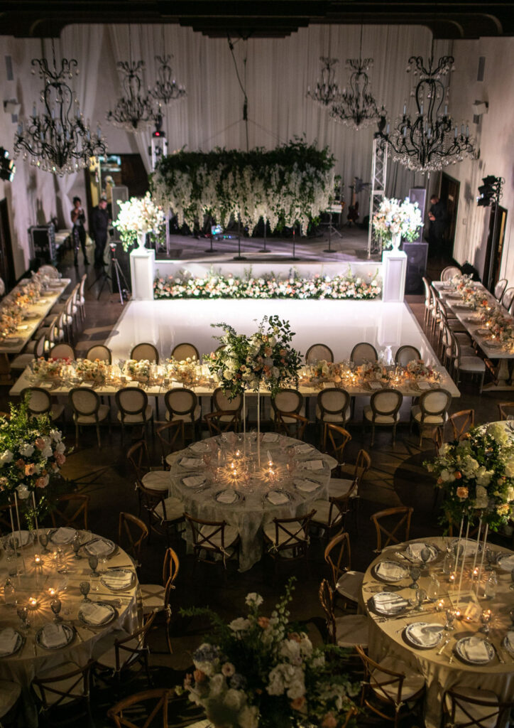 Grand ballroom reception with elevated floral arrangements at an Austin wedding venue with European elegance