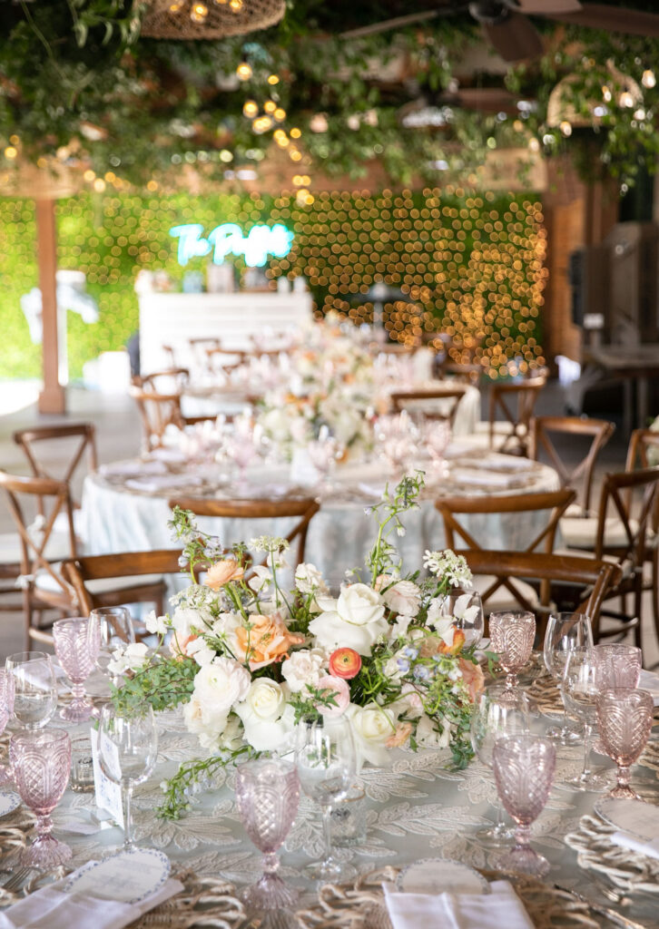 Reception tables with pastel florals and greenery