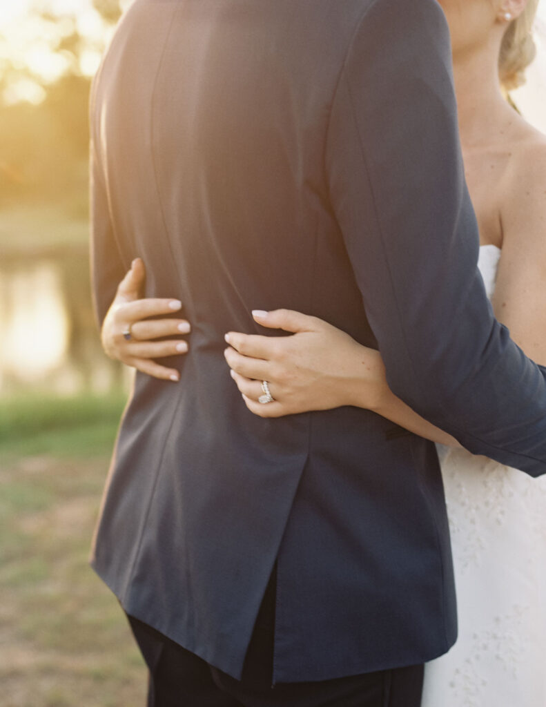 bride and groom hugging at wedding