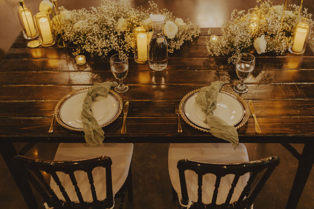 fall tablescape with sage napkins, roses, and baby's breath