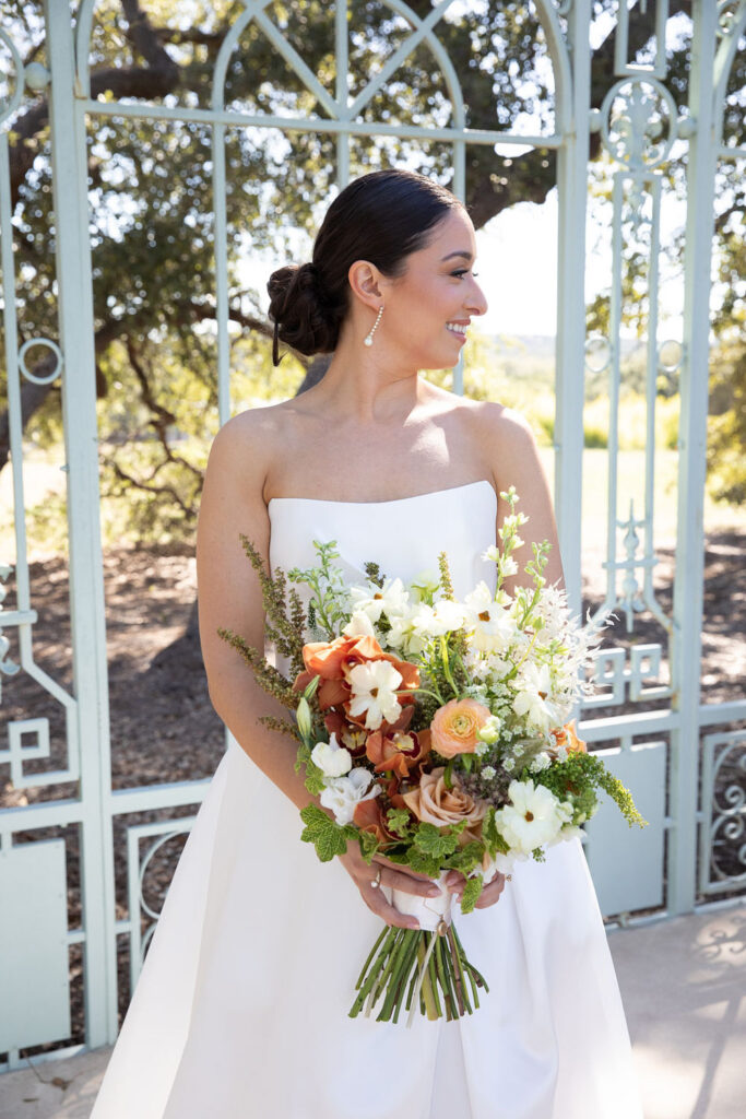 bride with autumn bouquet at Ma Maison wedding venue