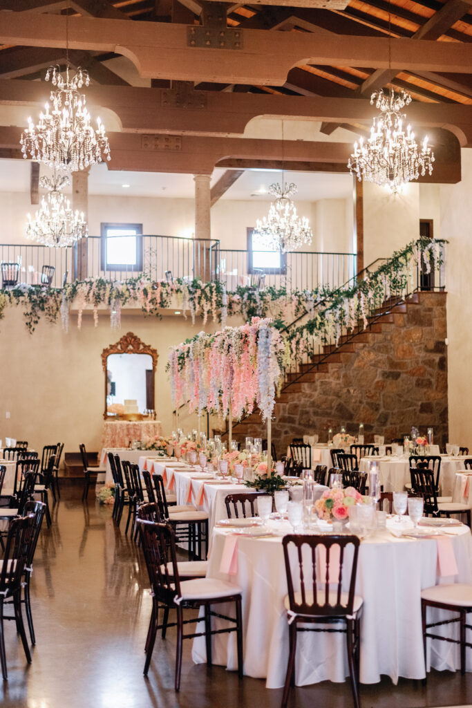 Pastel floral wedding reception tables inside Ma Maison