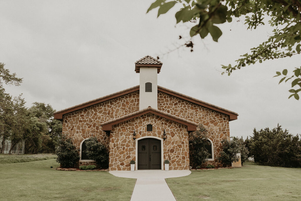 The stone chapel at Ma Maison, perfect for indoor ceremonies and couples seeking budget wedding venues in Austin with rustic elegance and all-weather options.