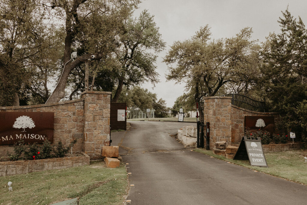 Private gated entrance to Ma Maison, highlighting exclusive access to one of the most scenic and budget-friendly wedding venues in Austin's Hill Country.