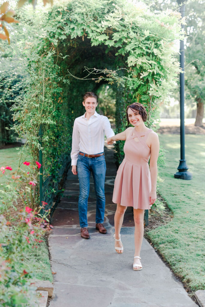 Tunnel of love, she said yes, proposal. Elegant Great Hall wedding reception at Ma Maison with chandeliers and classic decor.