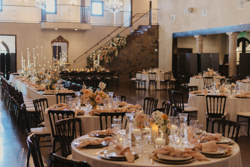 Elegant wedding reception with candlelit tables