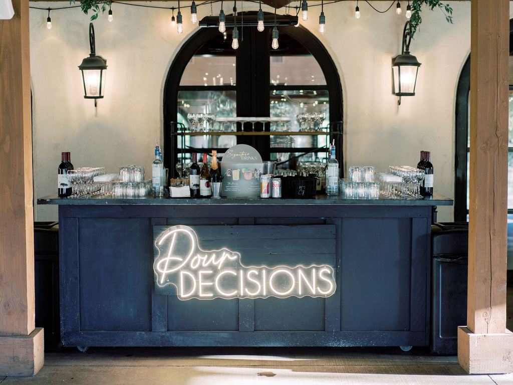 Wedding bar setup with neon sign at Houston wedding venues