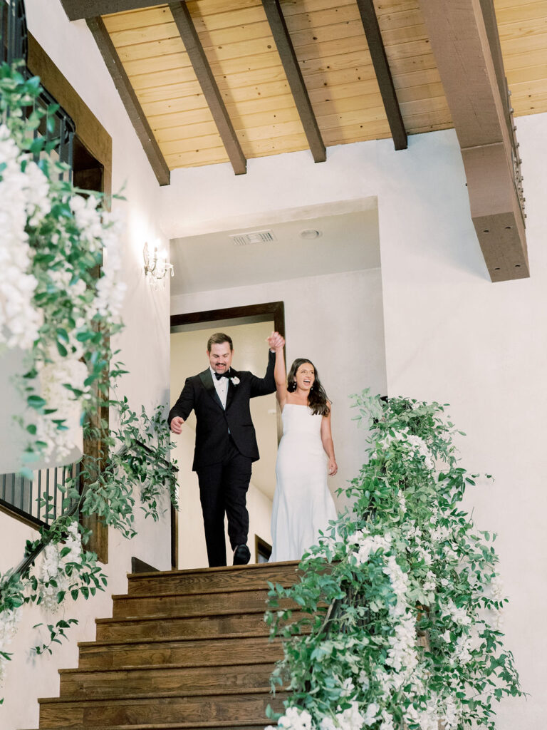 Bride and groom grand entrance on stairs