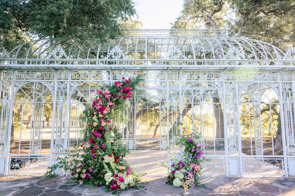 Outdoor ceremony arch with lush flowers