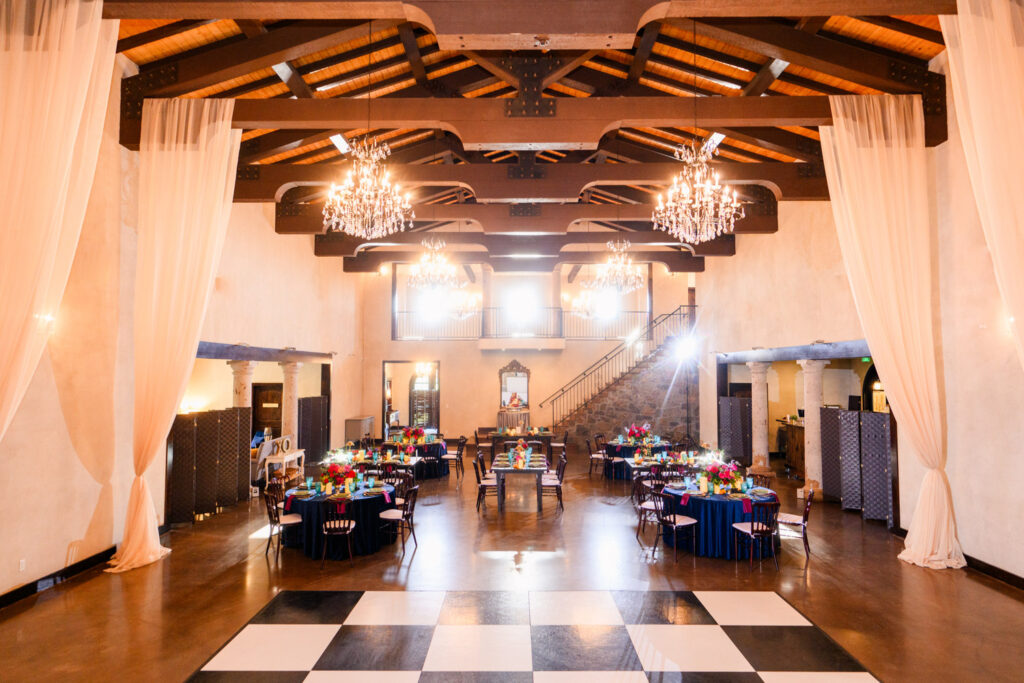Grand reception hall with chandeliers and elegant table settings