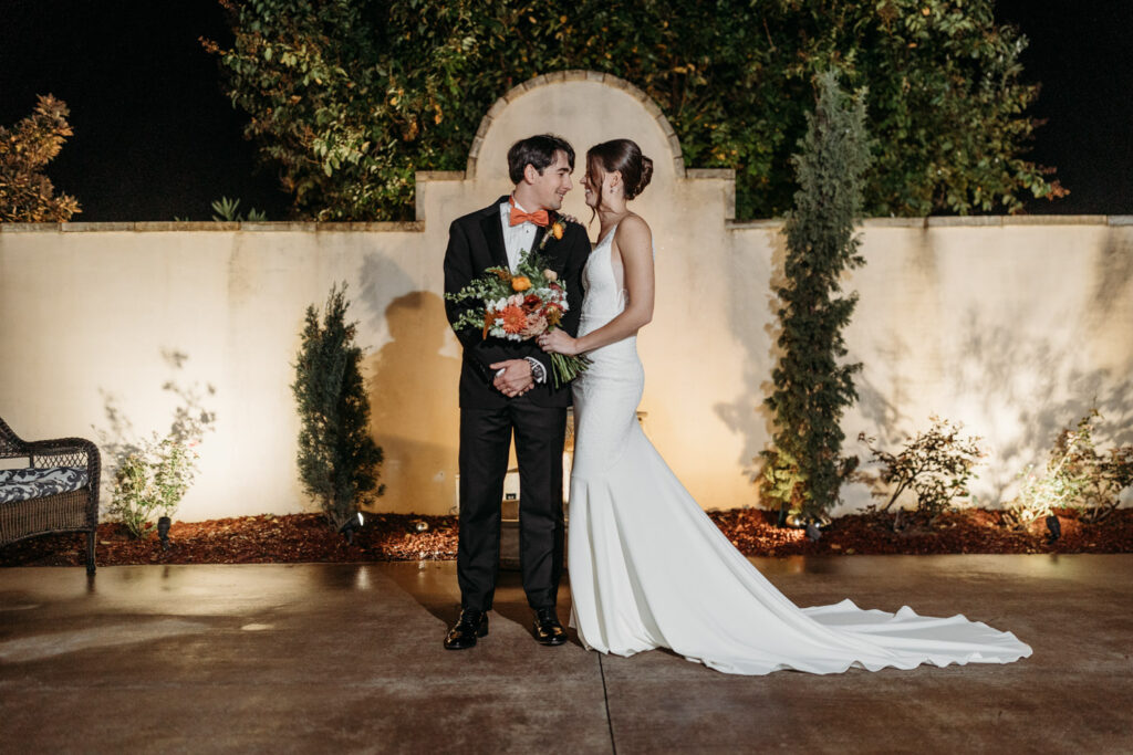 Bride and groom sharing a romantic moment at their Italian destination wedding in Austin, TX.