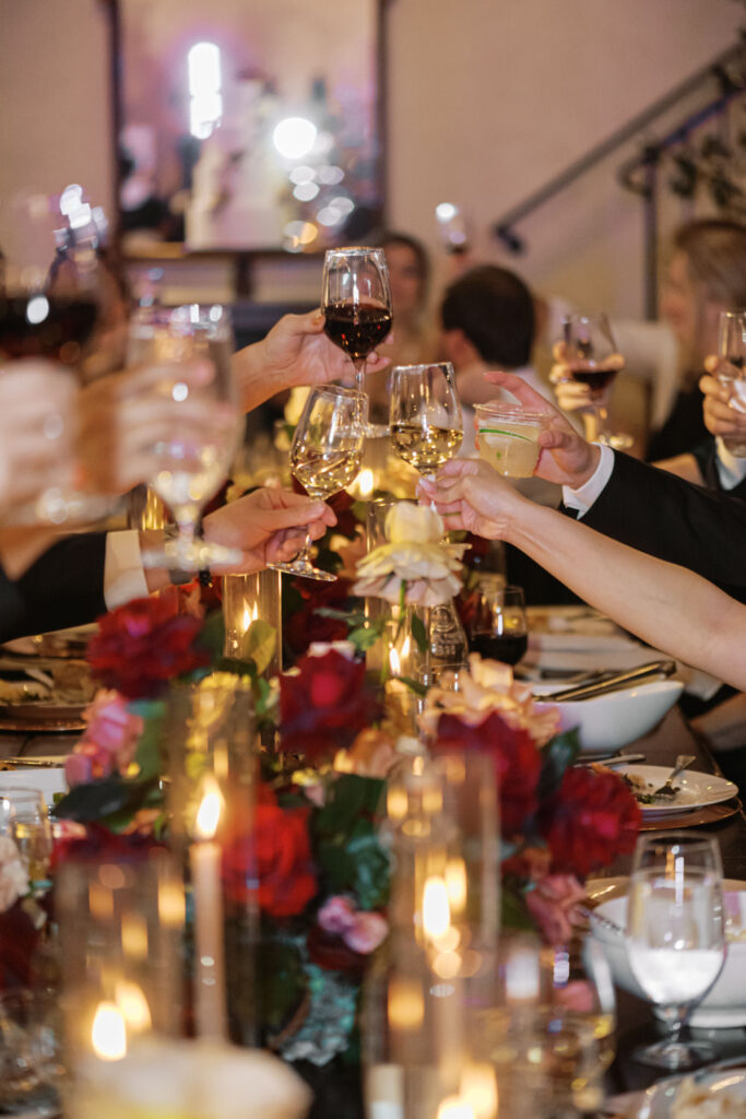 Guests raise their glasses in a celebratory toast at Ma Maison