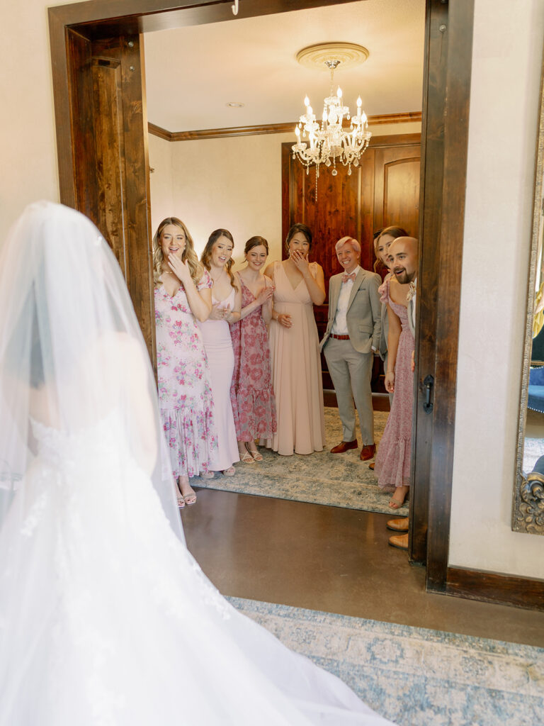 bridal party reacting to bride in bridal suite at Ma Maison wedding venue