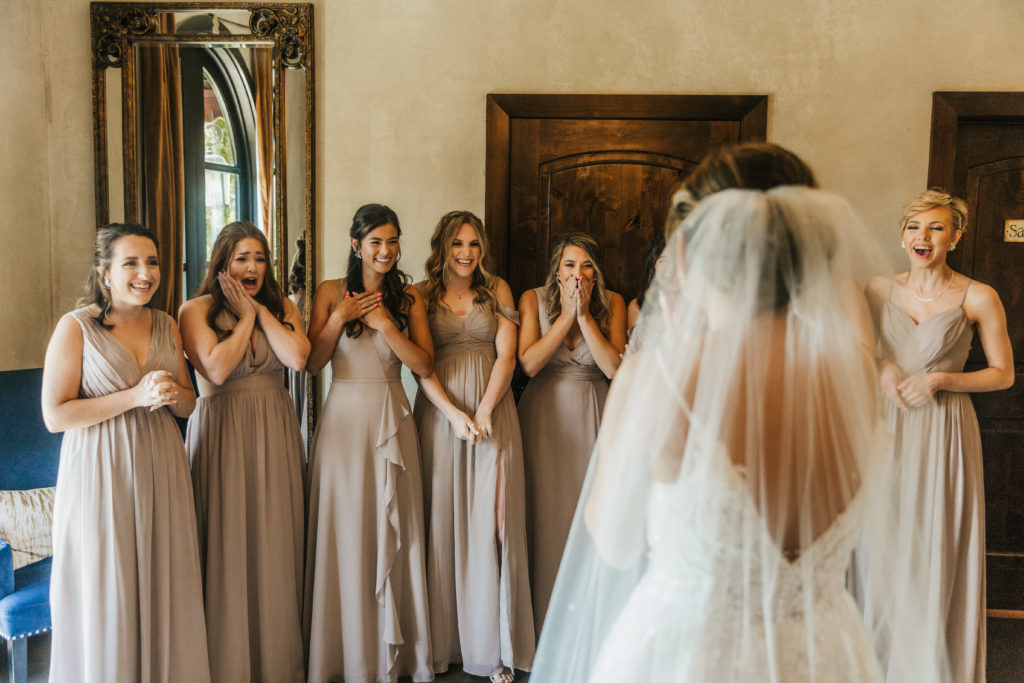 bride does dress reveal with her bridesmaids on her Texas wedding day