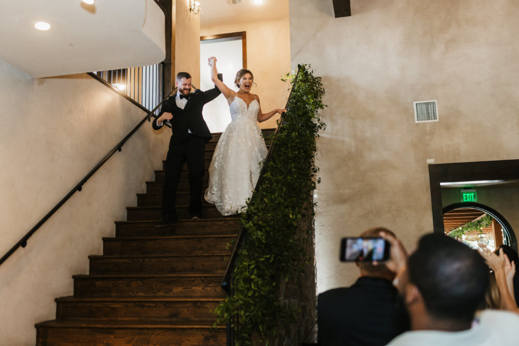 bride and groom enter wedding reception at Austin Texas wedding venue