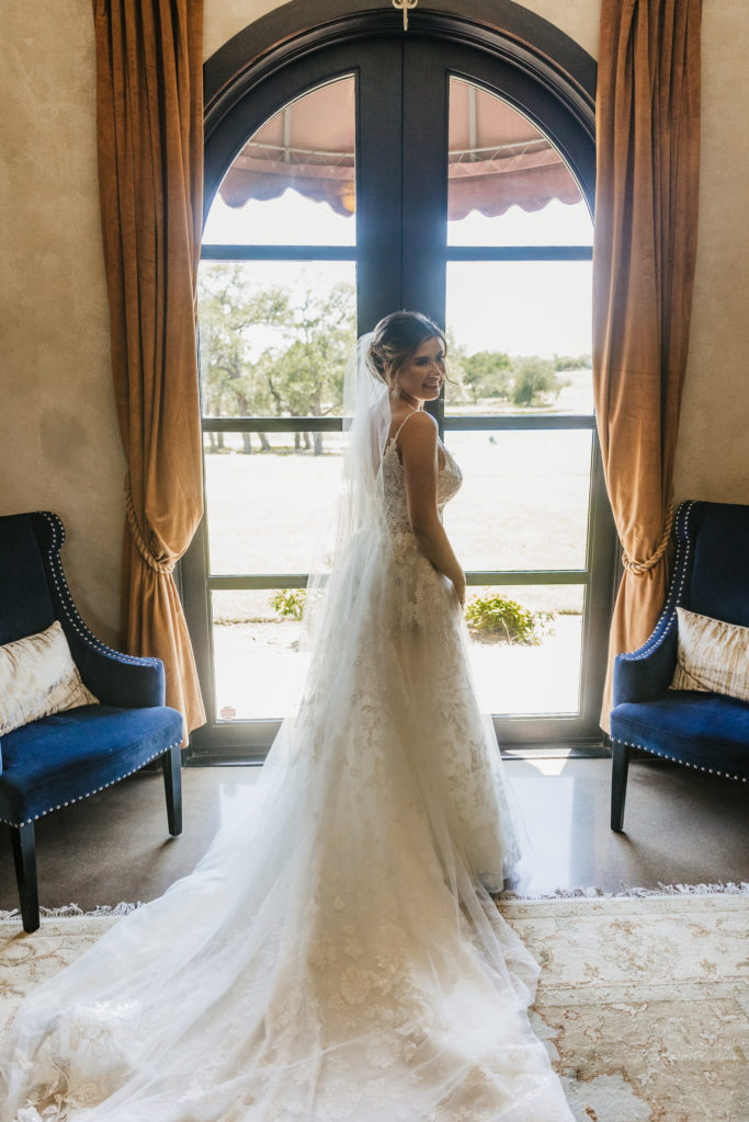 bride gets ready in dressing suite for her Texas wedding day