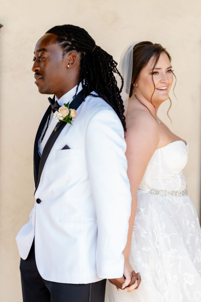 bride and groom holding hands before first look