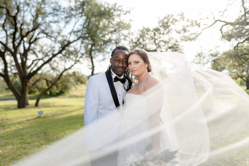 bride and groom looking at camera