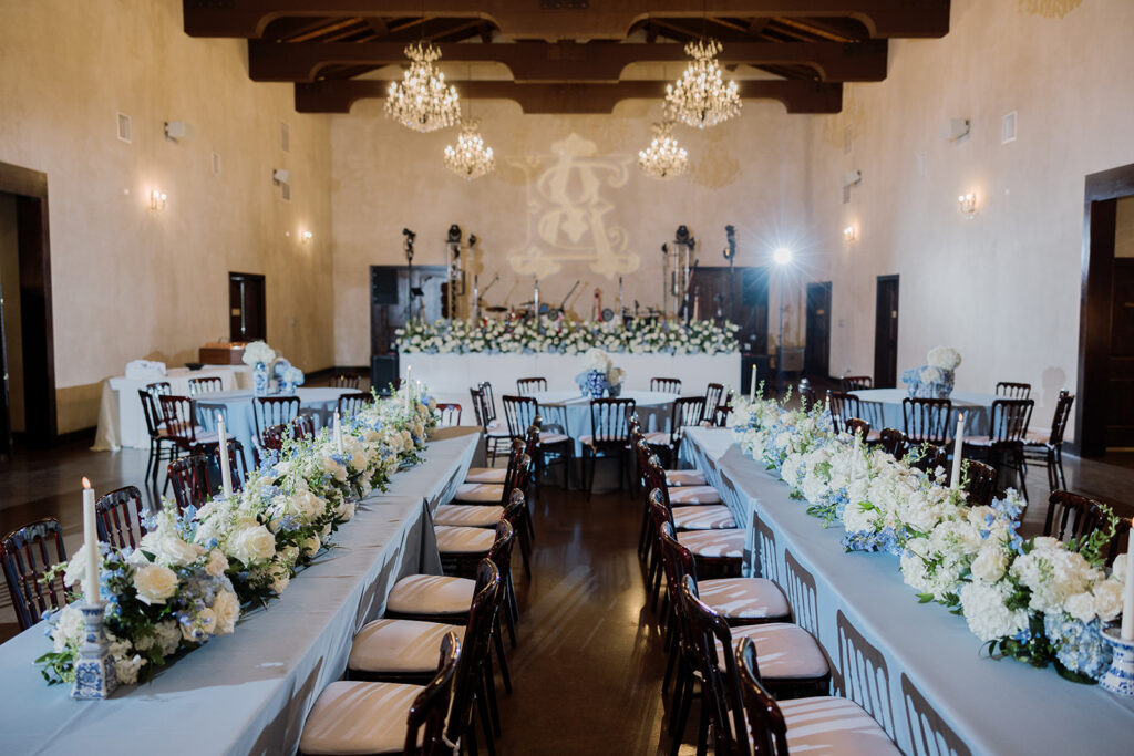 Elegant reception tables with blue and white florals inside a luxury Austin wedding venue