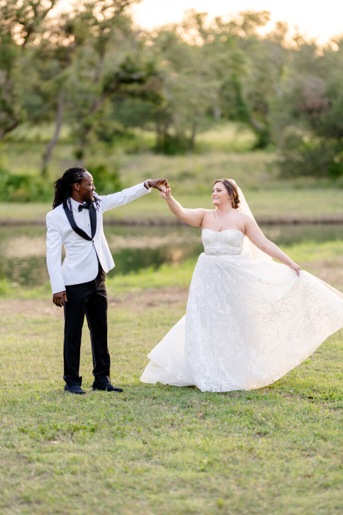 The newlyweds dance together on the lawn at Ma Maison