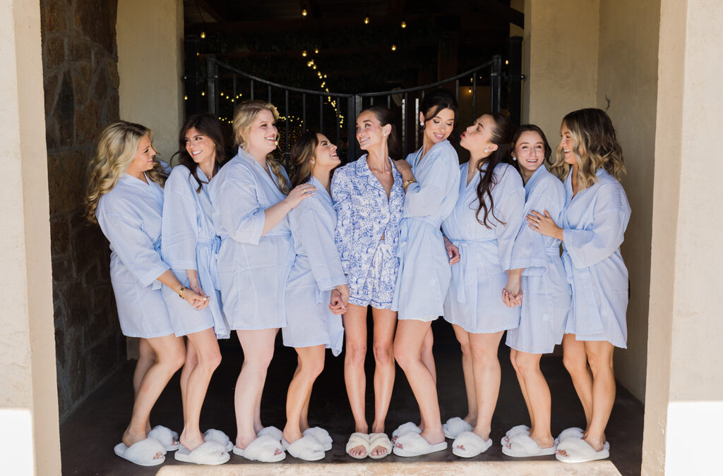 bridal party wearing blue pajamas and blue robes