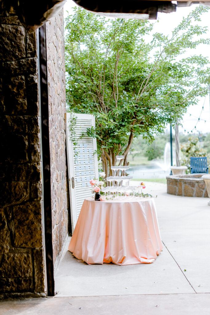 table with champagne glasses at Ma Maison wedding venue in Dripping Springs, Texas