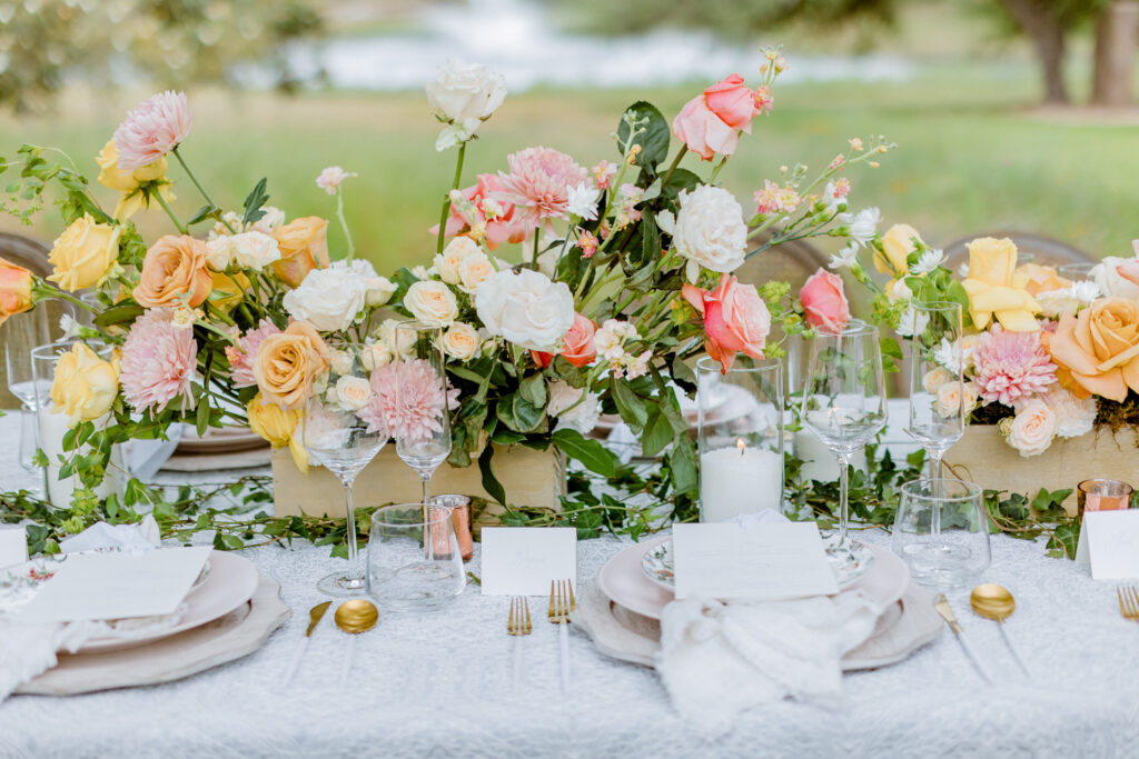 floral arrangements on a wedding reception table at Ma Maison wedding venue in Dripping Springs, Texas