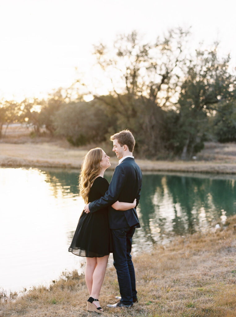 Quiet proposal moment by the lake at Ma Maison