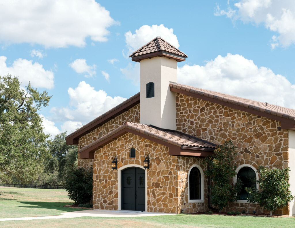 Charming stone chapel at Ma Maison one of the most popular wedding destination in Austin set against a backdrop of lush Texas Hill Country.