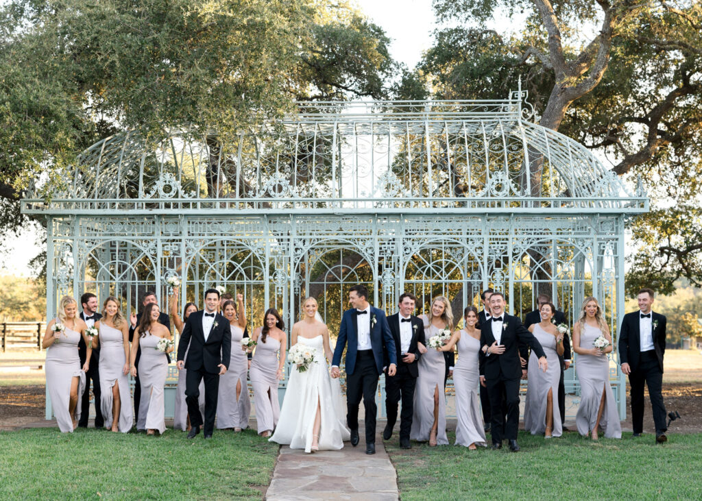 Wedding party walking in front of Gazebo