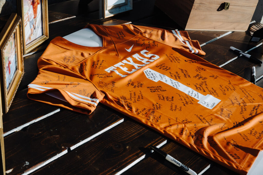 Personalized guest sign-in with a signed sports jersey at wedding