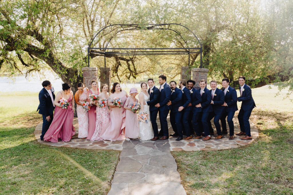 Playful wedding party photo showcasing fun and unique group poses