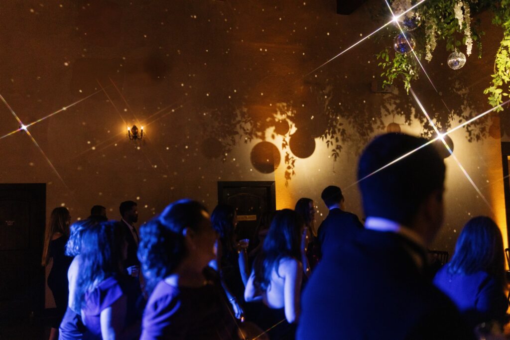 Guests dancing under ambient lighting created by a professional Wedding DJ in Austin.