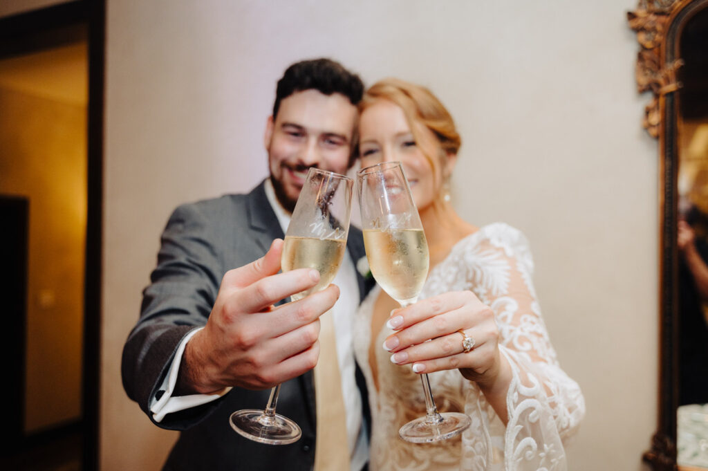 Bride and groom toast with champagne