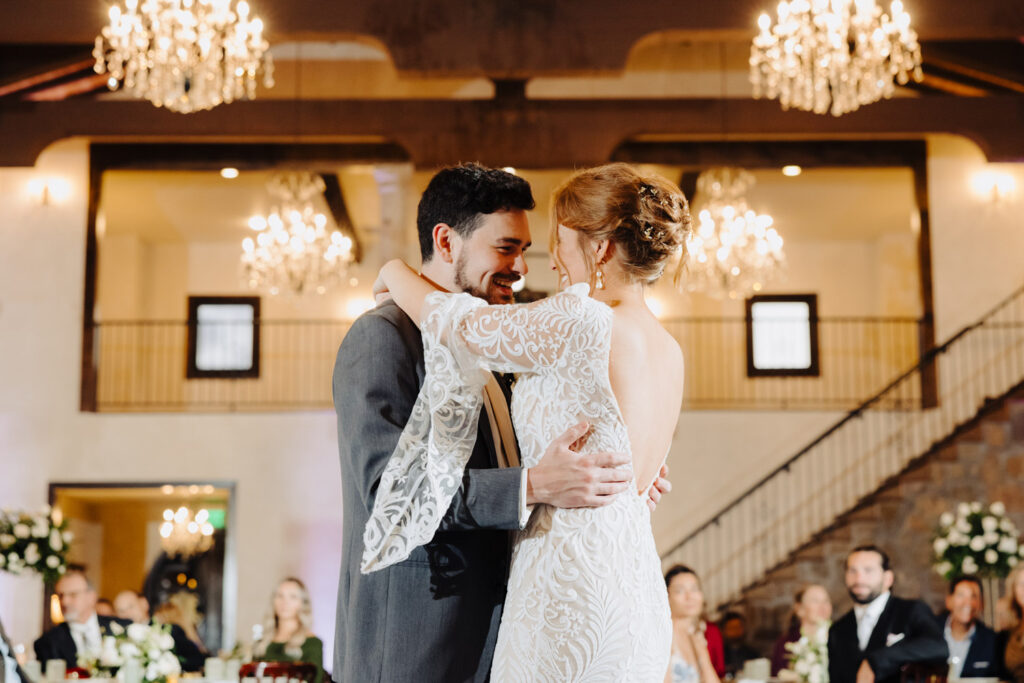 Nicole and Jacob share an intimate first dance at their winter wedding in Ma Maison’s Great Hall
