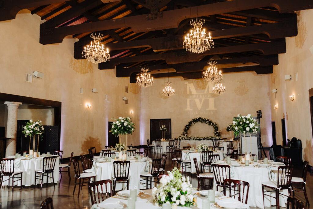 Elegant winter wedding reception setup at Ma Maison’s Great Hall with floral centerpieces