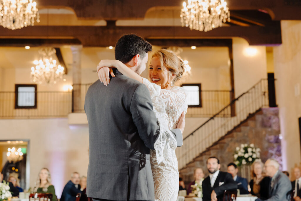 Bride and groom share their first dance during Nicole and Jacob’s winter wedding at Ma Maison