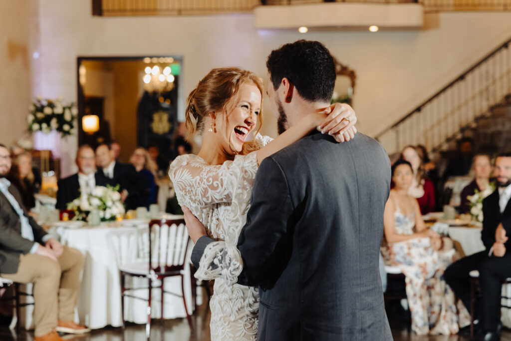 Close-up of bride smiling during the first dance at Ma Maison’s winter wedding celebration