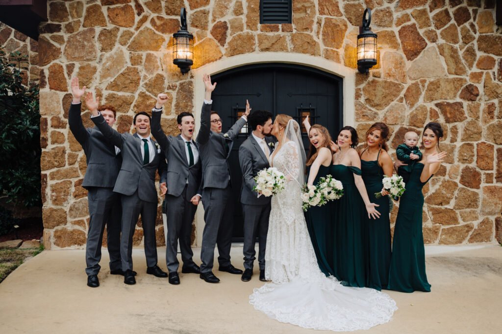 Bridal party cheers as Nicole and Jacob kiss